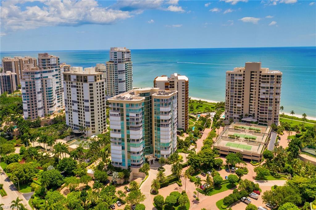 Bay Shore Place is located on the gulf side of Gulf Shore Blvd in Park Shore. Wake up to sunlight pouring through floor-to-ceiling windows and step outside to your private wraparound balcony for Gulf breezes and amazing views. This beautifully renovated two-bedroom residence at Bay Shore Place blends fresh, modern architectural details with an effortless resort-style flow, perfectly placed in the heart of Park Shore in Naples, Florida, just steps from miles of white sand beach on the Gulf.
Inside, an open, light-filled layout makes everyday living feel like a permanent vacation. Outside, Bay Shore Place delivers true resort-caliber updated amenities: two beautifully appointed guest suites, a library, a social room, a fitness center, a sparkling pool, and meticulously maintained common areas throughout the building. A deeded, under-building parking space adds everyday convenience, and this is a pet-friendly community.
Just beyond your door, Venetian Village offers waterfront dining and boutique shopping, while Park Shore Marina and Venetian Bay Yacht Club put boating and life on the water within easy reach. Few residences in Naples combine this much sunshine, location, and lifestyle in a single address.