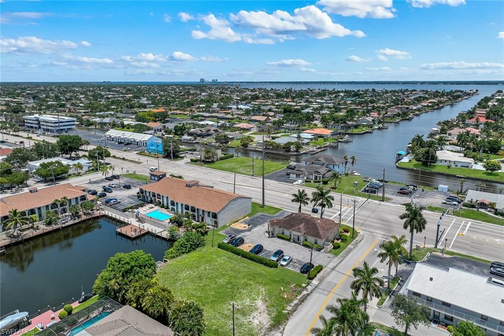 Attention Builders, Developers & Investors! Rare opportunity to own an exceptional commercial Gulf-access waterfront lot in the highly desirable Southeast Cape Coral corridor. This oversized parcel offers city water and sewer with assessments paid, providing a solid foundation for your next commercial project.Ideally located just off Del Prado Boulevard, this property offers outstanding accessibility, high visibility, and is only minutes from Cape Coral Parkway, the Cape Coral Bridge, downtown Cape Coral, shopping, dining, and professional services. The convenient location makes it an ideal destination for businesses looking to serve both the local community and the area’s growing waterfront lifestyle.With direct Gulf access, this property is perfect for a variety of commercial ventures, including professional offices, boutique commercial space, a waterfront restaurant or café, marine-related businesses, or other commercial uses permitted by current zoning and City of Cape Coral regulations. The scenic waterfront setting provides an attractive environment for customers and clients while enhancing the long-term value of your investment.Commercial Gulf-access waterfront parcels are extremely limited, making this an outstanding opportunity for builders, developers, and investors seeking a distinctive property in one of Cape Coral’s fastest-growing commercial districts. Bring your vision and transform this exceptional waterfront site into a premier commercial destination.