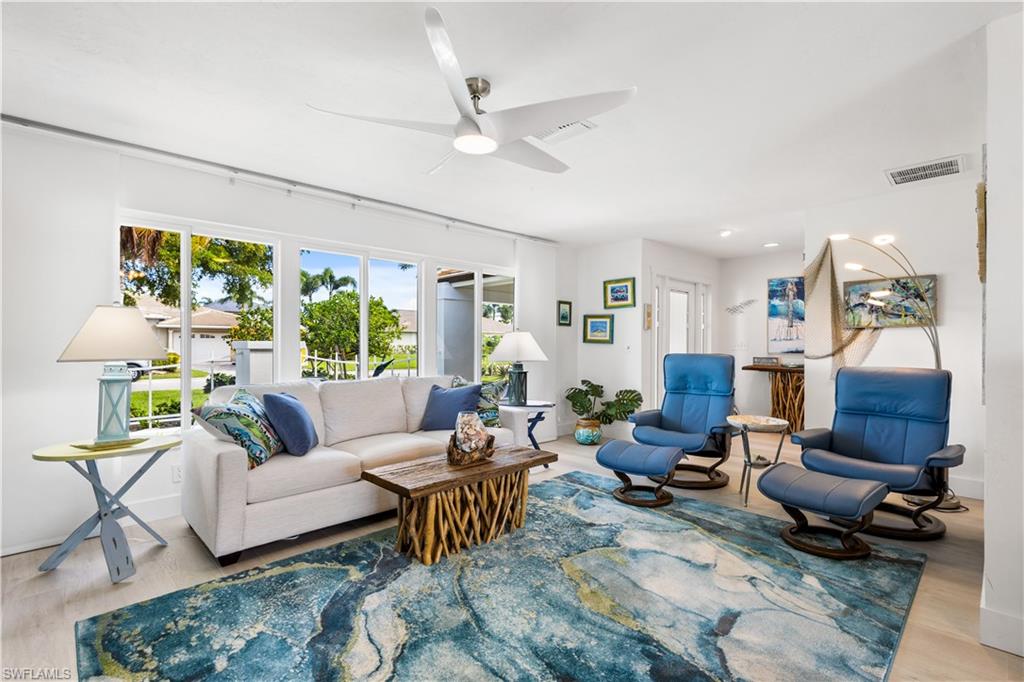 Welcome to the sought after community of Town & River,a Deed Restricted Community.This one of a kind southern exposure home has been tastefully updated! This coastal décor POOL home offers 4 bedrooms,2 baths & 2 car garage.The split floor plan has HURRICANE IMPACT WINDOWS AND PATIO DOORS and has been tastefully updated in 2023.The kitchen offers custom two tone cabinetry,exotic granite countertops,LG stainless steel appliances.Waterproof luxury vinyl throughout & Shiplap in the dining area.Solid core doors throughout,trim and baseboards.Completely repainted inside and out in 2023.New garage door and opener.A/C and whole house duct work replaced in 2022.2021 new well pump for irrigation.Solar system pool heater,ceiling fans.Private master ensuite offers walk-in shower & a walk-in closet.Also new in 2023:Pool pump,hot water heater.3 nicely sized guest bedrooms & bath are located on the other side of the home.Perfect for growing families or for visiting guest!2nd bath has a walk in shower and serves as your pool bath.Sliding glass doors showcase the gorgeous views of the lake overlooking your Lanai,pool,seating area! Perfectly located w/dining,shopping,Fort Myers & Sanibel Beaches just minutes away.AMAZING WALK THRU VIDEO TO APPRECIATE THIS HOME!