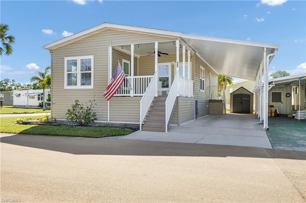 Move-in Ready.  Enchanting Acres Mobile Home park, This is a Jacobsen mobile home (2014) features 2 bedrooms plus a Den. This has a Great room open floor plan with den off the dining room area. Front Patio. Vinyl flooring, Tall carport, Vinyl siding, Impact single hung Windows, Laundry room inside residence. HVAC, Whole house ventilator, Primary bedroom has a walk-in closet and Primary bathroom has a shower. Double French doors will lead you into the den. Enchanting acres is a 55 plus in age community with a community pool, shuffle board, club room. Public across the street you have a Publix, movie theater, shopping and restaurants. Close to Sugden Park, Bayshore Arts District, 5th Avenue South, 3rd Street South and the beaches.