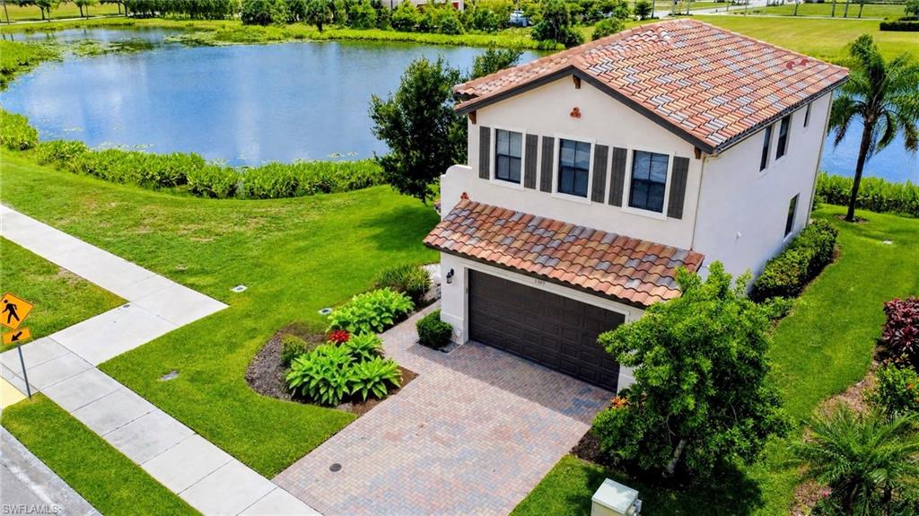 One or more photo(s) has been virtually staged, AI generated or rendered.  Why wait months for new construction when you can move right into this well-maintained, move-in ready lakefront home in the desirable Coquina at Maple Ridge community of Ave Maria. This 3 bedroom, 2.5 bathroom home offers peaceful lake and sunset views with no homes across the water, just open greenery for added privacy. As an end-unit property, it provides additional space, privacy, and convenient access to main roads.
Inside, the home features fresh interior paint, soft gray flooring throughout, new ceiling fans, and window coverings in every room. The open layout is designed for comfortable everyday living. The spacious two-car garage includes epoxy flooring, overhead storage, and an additional refrigerator, offering both function and convenience. Located within walking distance to shops, restaurants, a gas station, car wash, and more, this home combines convenience with lifestyle. Residents enjoy access to Maple Ridge amenities including a resort-style clubhouse, pool, fitness center, parks, and community spaces. Additional Ave Maria amenities include walking and biking paths, sports parks, playgrounds, dog parks, shopping, dining, and a vibrant town center. One or more photo(s) has been virtually staged, AI generated or rendered.