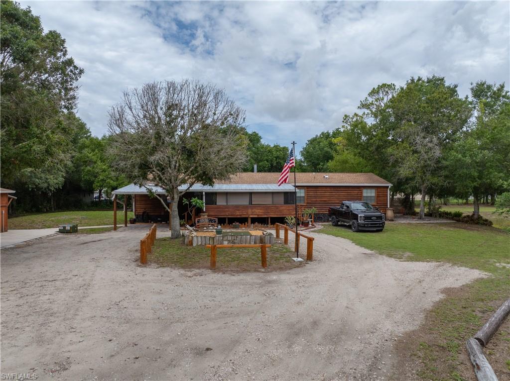 This property is a rare gem, perfect for anyone looking for acreage and a country feel while remaining close to modern conveniences.
This spacious 4-bedroom, 3-bathroom home offers extensive deck space and out-buildings that provide an ideal "getaway" from the main residence. The property also features a large above-ground pool surrounded by a beautiful lounging deck where you can enjoy the serene surroundings. Additionally, the home is conveniently connected to city water.