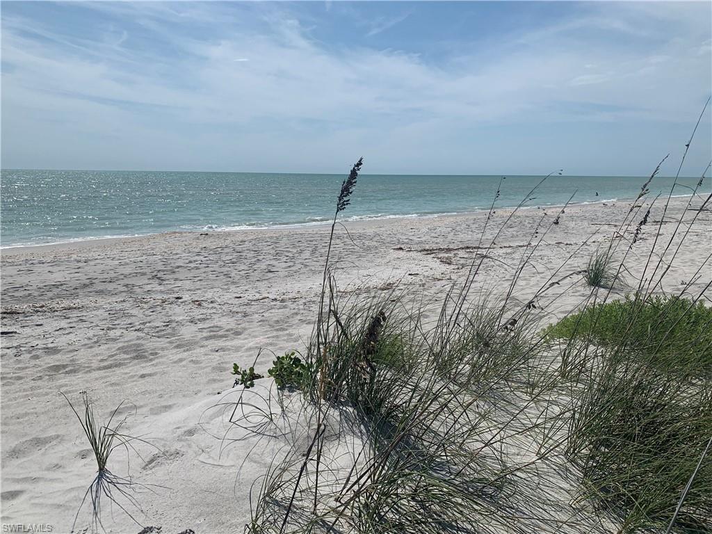 Incredible opportunity with this price reduction~ Beachfront Estate with the best views on the island! A long winding driveway takes you to a private home sitting on over 2 acres on the Gulf of Mexico. Unobstructed views of the Gulf! 4 bedroom+den & 5 bath home ~ a perfect beach oasis. The lot is one of a kind on the Gulf unobstructed views and almost 1000' deep. The home is over 3700 sq ft plus large lanai. Expansive great room with fireplace, beamed ceilings and a wonderful kitchen with pantry and laundry, elevator, 2 +car garage, new metal standing seam roof is already underway.Two new condensers and ductwork installed screened lanai and open decks across the entire Gulf side, large master suite with beamed ceilings large walk in closet with remarkable views of the Gulf.  Sunsets every night and private beach path out to the widest beach on Sanibel. Gulf Ridge is a small private community with 18 beachfront estates & community pool and tennis. No nearby multi family or hotels so provides very private beachfront living.  This home was impacted by Ian no flooding in the home but wind and storm damage which was remediated immediately~ no mold. New Pella Impact Windows and New Roof.
