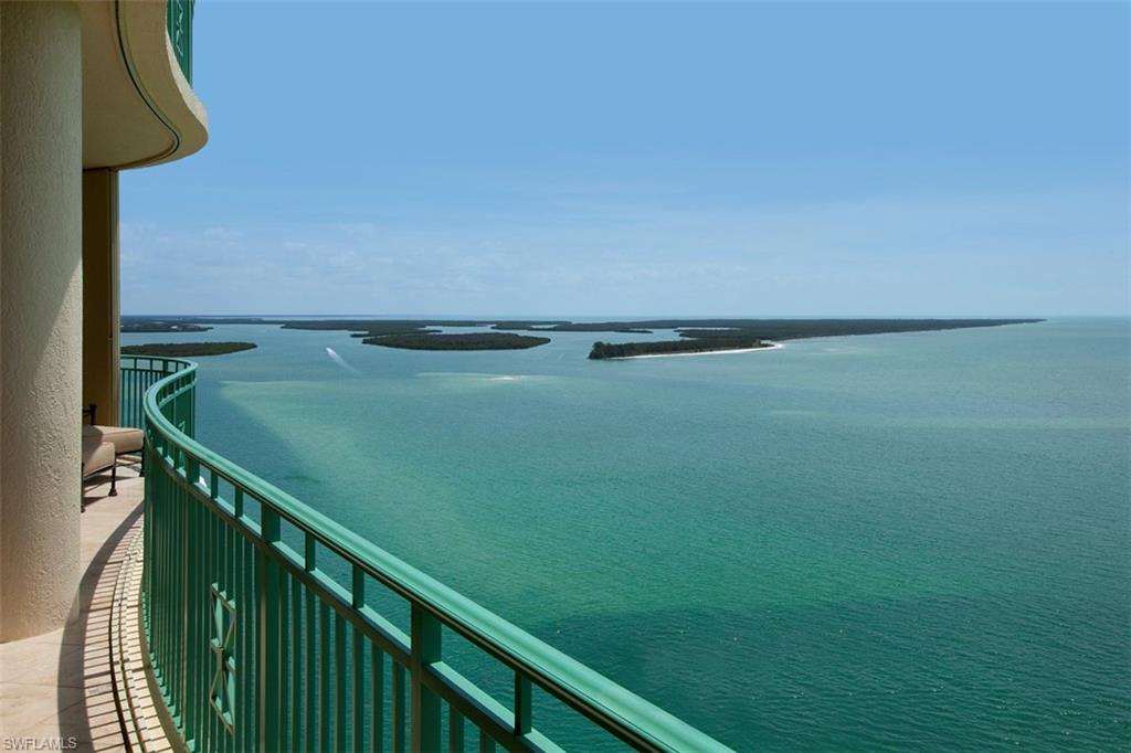 Impressive penthouse offering the ultimate in waterfront living boasting over 7100 sq ft of opulent  living space. Captivating panoramic views of the Gulf & 10,000 Islands. Expansive & private terraces. Southern exposure.  Sophisticated coastal elegance, distinctive architectural details, lavish upgrades, specialty electronics, extensive custom design, elegant furnishings & incredible attention to detail, craftmanship, & function.  Elegant grand salon with wall of windows for Gulf views offers stunning marble floors with intricate glass inlay, elaborate faux finishes, entertaining bar, one touch lighting & music. The sprawling interior makes entertaining a pleasure with all rooms opening up seamlessly to the outside living spaces.  Formal dining with coiffered ceiling & artisan detailing comfortably seats 10  Gourmet kitchen offers Viking range, extensive upgrades & enlarged Island. Family room with fireplace, Brazilian mahogany floors & custom entertainment center is surrounded by water views.  Elegant master suite is a private sanctuary with luxurious bedding, lavish spa like master bath & sauna. 4 private guest suites for family, plus den/office media room. Rare 2 car A/C garage