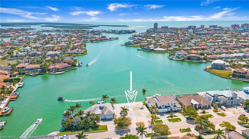 Stunning Wide Water Views! This direct access lot, with its incredible southern exposure views of Smokehouse Creek, has a brand new 100’ wide seawall and sidewalks. A boater’s paradise, it includes quick access to the Gulf, while allowing for one of the largest docks possible. The dimensions are 100’ wide by 110’ deep with mature palm trees, cleared and ready to build your dream home. Located less than a mile from our white sandy beaches and some of Marco Island’s finest restaurants, shops, and much more. Don’t miss your chance to own this piece of paradise.
