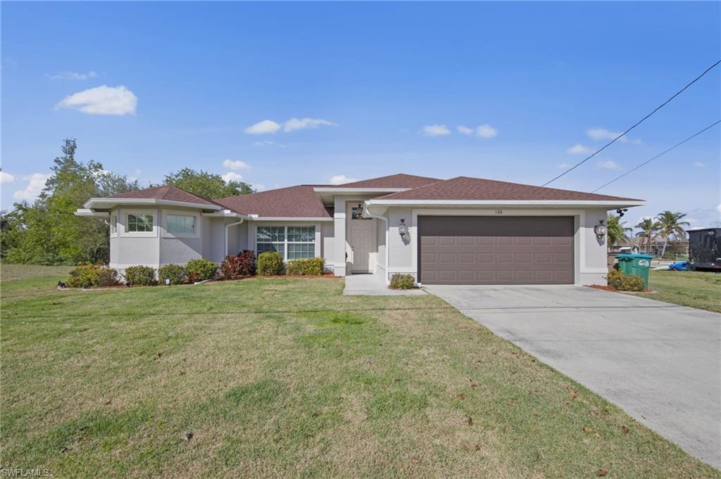 Enjoy living the southwest Florida lifestyle in this immaculate 2020-built waterfront pool home. Offering breathtaking water views and beautiful sunsets, this move-in-ready gem is perfectly situated for relaxed coastal living. Boasting approximately 1,900 square feet of air-conditioned living space, this 3-bedroom, 2-bath residence features elegant marble tile flooring and soaring high ceilings throughout the main living areas. The bright, open-concept design flows seamlessly into a spacious kitchen complete with white shaker cabinets, a large center island, stainless steel appliances, and sophisticated lighting.The master bedroom suite offers a luxurious private bath with dual sinks, a deep soaking tub, and a separate walk-in shower. Two additional bedrooms provide flexibility for guests, a home office, or family room. Step outside to your private waterfront oasis. The sparkling pool and expansive paver patio create an ideal setting for entertaining or unwinding, while the western exposure delivers spectacular southwest Florida sunsets. Enjoy a concrete seawall and dock ready for lounging, fishing, or tying up your boat. Additional highlights include a two-car attached garage, on city water and sewer with all assessments paid. Conveniently located near ample dining, shopping, and entertainment, this home offers the perfect blend of luxury, location, and lifestyle.