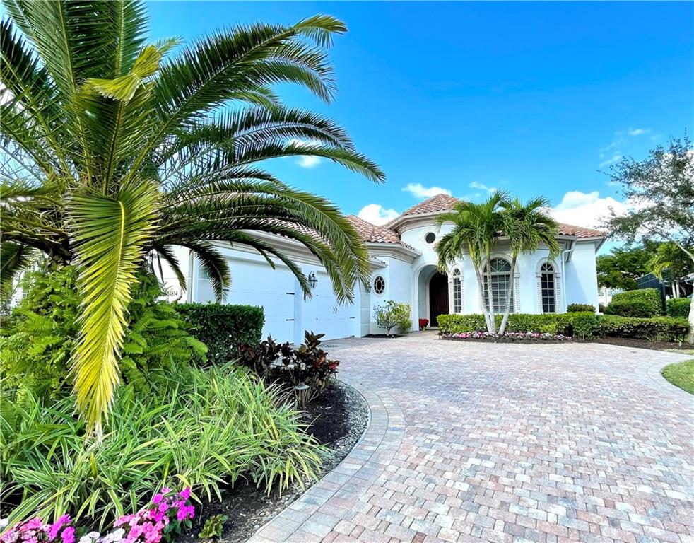 This stunning villa in Bellezza of Mediterra boasts sparkling lake and golf course views! Impeccable landscaping & a brick paver drive lead you into the grand entrance of this lovely home. Designer appointments are found throughout the home, including volume ceilings and gorgeous marble flooring throughout the main living areas. This open floor plan is light and bright with abundant natural light flowing through expansive windows and doors. The gourmet kitchen features stainless steel appliances, rich raised wood cabinetry, and granite countertops. The open great room overlooks the pool with tropical views beyond. The master suite is a relaxing retreat with private access to the lanai. The master bath offers his and her vanities, a large soaking tub, and a walk-in shower. Outdoor living opportunities abound on the expansive screened lanai.
