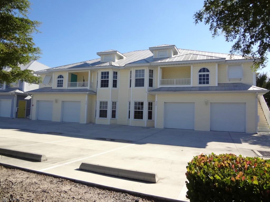 FANTASTIC condo on LAKE KENNEDY!! Very 'OPEN' floor plan with BIG VIEWS of the LAKE! Built to take advantage of the water views! DOWNSTAIRS END UNIT! Lots of sliding glass doors and big windows! HEATED POOL & SPA! Private DEEDED BOAT DOCK! Unit has it's own GARAGE! 'Old Florida' style condo with metal roof & plantation shutters! CONCRETE construction! ALL TILE FLOORS! Good sized screened lanai! Kitchen has upgraded wood cabinets, Lazy Susan, GRANITE tops, & STAINLESS STEEL appliances! Master bedroom has sliders to lanai, walk-in closet, and TRAY ceiling! Inside laundry! VERY WELL MAINTAINED UNIT! GREAT LOCATION-convenient to Pine Island Rd! HOME WARRANTY too! Don't miss this opportunity to own your piece of paradise! Hurry, before it's gone!