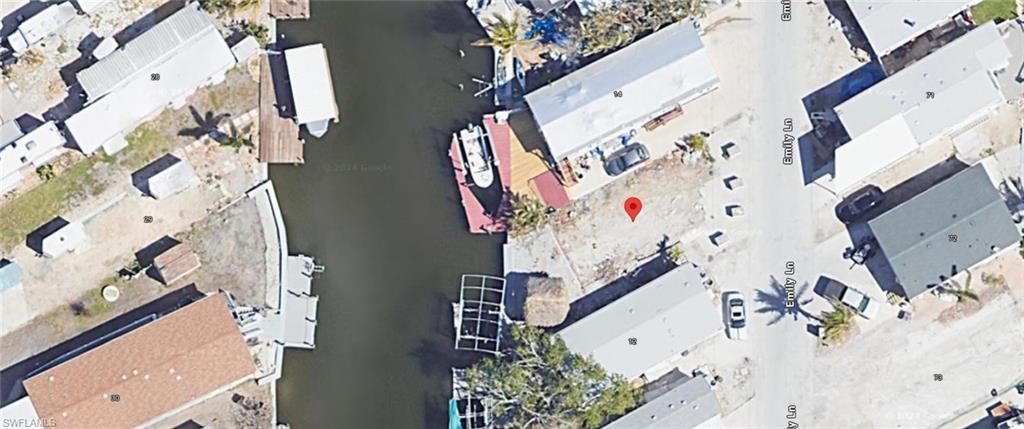 What a great location for direct gulf access, this beautiful lot comes with so may opportunities for you to start your dream of live on the water and let the gulf take you where ever your adventures land you . The added bonus is there is already water, sewer, electricity, boat lift and paver pad with a tiki hut for you to relax and dream of your next adventure. There is plenty of shopping, restaurants and of course the beach all with in walking distance.