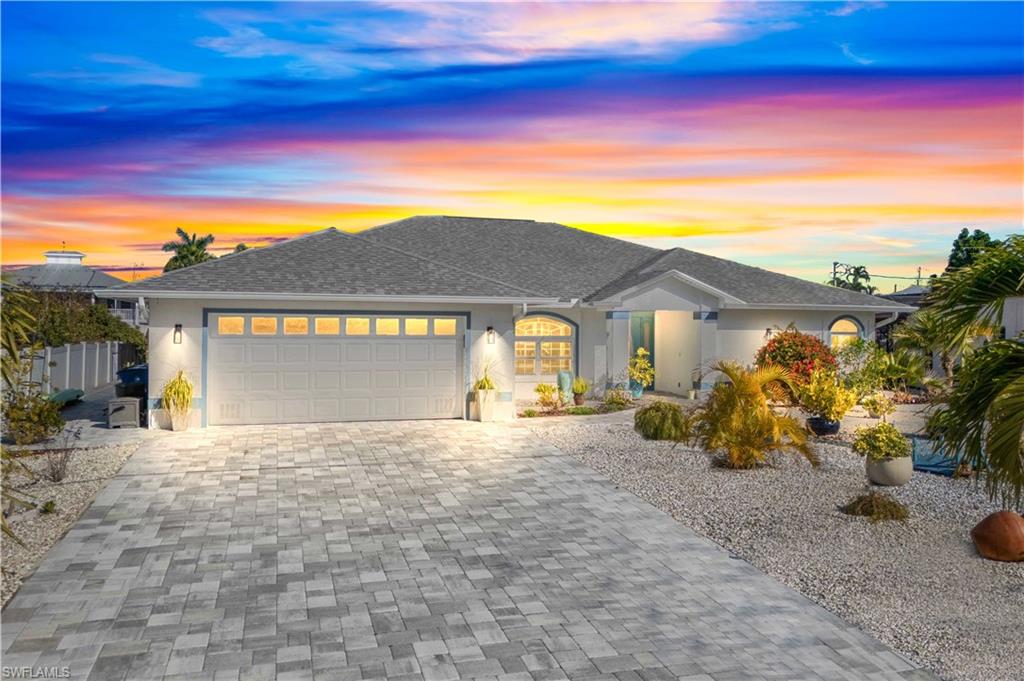 Effortless luxury meets true Gulf access—without a single bridge in sight. Located on the PERFECTLY named Manatee Canal, where dolphins and manatees play, this professionally remodeled 3 bedroom waterfront residence on Pinetree Drive delivers DIRECT, deep-water access to the Gulf, complete with a covered boat lift and private kayak launch - a boaters dream!  Super curb appeal on this oversized lot with extended driveway and additional parking across the street!  Meticulously cared for and it shows both in and out of the home. Inside, the home showcases refined coastal elegance with neutral flooring throughout, a stunning chef’s kitchen featuring shaker-style cabinetry, a large open island, Jennair appliances and quartz countertops - its a beauty! Cornerstone did the remodel and it is spectacular! Filled with abundant natural lighting, luxury upgrades and thoughtfully designed to create a seamless blend of comfort and sophistication, this home flows and is the perfect size with spacious rooms and neutral colors!  The outdoors is a DREAM - an EXTRAORDINARY maintenance-free entertainment oasis awaits—multi patios fully pavered and purpose-built for hosting, with multiple patios, a resort-style pool and stand alone spa, and a fully equipped outdoor kitchen - perfect to hang out with friends and enjoy the amazing paradise that surrounds you. A large fenced side yard, oversized lot, and additional parking across the street add rare convenience. Set in one of St. James City’s most desirable waterfront communities, this exceptional property offers the ultimate Pine Island lifestyle—plus the rare advantage of an ASSUMABLE 2.75% loan.   There are so many additional special features such as a community boat ramp, a 17 mile biking/walking path, boating or walking to multiple restaurants and marinas - you are so close to days of adventures exploring the waters and the incredible islands that surround you.  St. James offers a vibrant lifestyle where you can live your best life!   If you are looking for more than just an ordinary home you have found it!  ASSUMABLE FLOOD INSURANCE OF $1,529 a year!