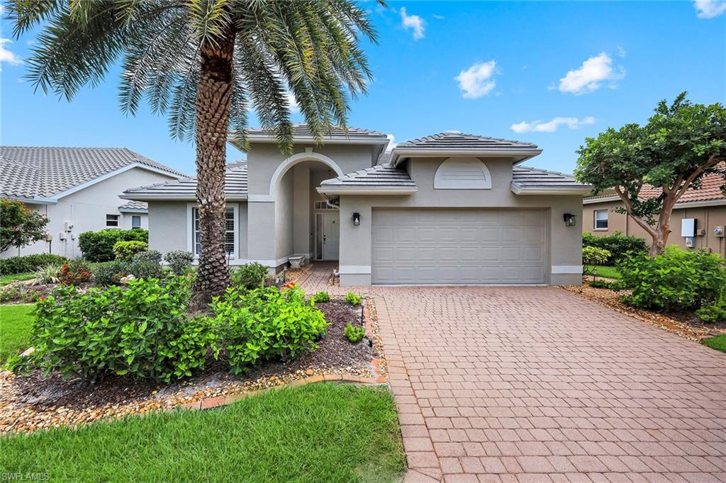 Welcome to 25061 Bay Cedar Drive, an impeccably renovated poolside retreat within Pelican Landing's Bay Cedar neighborhood. Surrounded by tropical landscaping and offering serene golf course and garden views, this exceptional three-bedroom, two-bath residence seamlessly blends sophisticated updates with the relaxed elegance of Southwest Florida living. Designed for comfortable everyday living and effortless entertaining, the light-filled floor plan was thoughtfully reimagined during the renovation to create an open-concept living experience. By opening and connecting the great room, kitchen, dining area and breakfast nook, the home now offers seamless flow, enhanced sightlines and an abundance of natural light throughout the main living spaces. The fully renovated kitchen serves as the heart of the home, featuring white shaker soft-close cabinetry accented with designer blue details, a generous quartz-topped island, stainless steel appliances and custom built-in cabinetry in the adjacent dining area. Expansive windows and sliding glass doors flood the home with natural light while creating a seamless connection to the private outdoor oasis. Extensive upgrades provide style and peace of mind, including a beautifully remodeled kitchen with new appliances, luxury vinyl plank flooring, updated lighting throughout, custom built-in Murphy bed and desk, fresh exterior paint and a newer roof (2018). A comprehensive pool renovation completed in 2015 transformed the outdoor living experience with a terrazzo stone pool deck, spa, updated pool equipment and a new screened enclosure. The exceptionally private lanai offers an ideal balance of covered and sun-filled spaces for dining, relaxing, and entertaining while enjoying tranquil golf course vistas and lush landscaping. Whether hosting guests or savoring a quiet morning coffee, this outdoor sanctuary is designed to be enjoyed year-round. Residents of Pelican Landing enjoy an unparalleled lifestyle with extraordinary amenities, including a private 34-acre Gulf-front island beach park, Gulf-access sailing, kayaking and canoeing, a community boat ramp, 12 Har-Tru tennis courts, pickleball, bocce and a state-of-the-art fitness center with trainer-attended programs. Ideally near world-class beaches, dining, shopping, healthcare and Southwest Florida International Airport, this move-in-ready residence offers the best of Florida lifestyle.