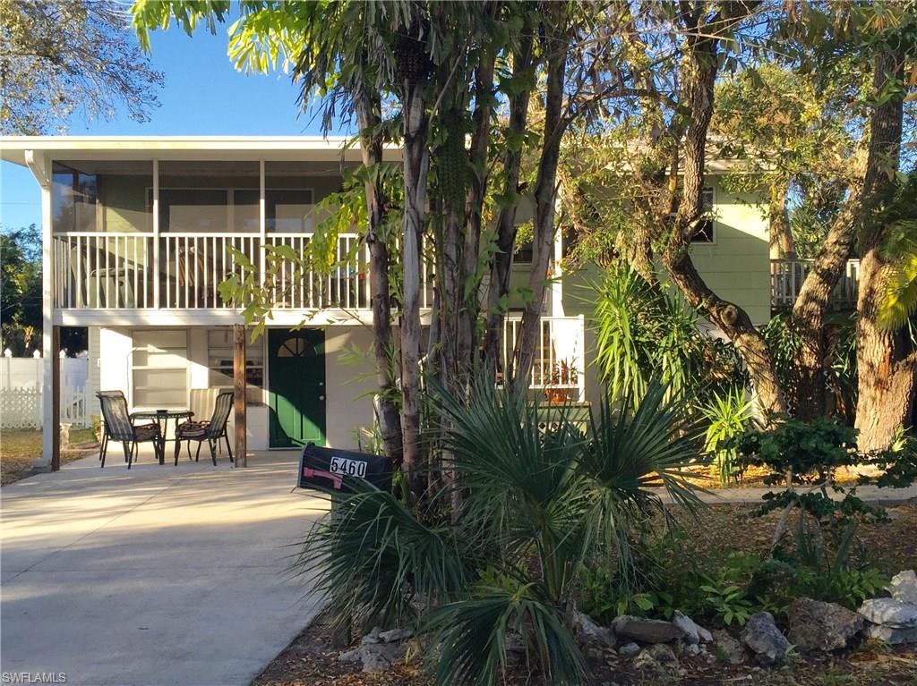 Florida style home with 4 bedrooms and 4 baths.  Nestled on the end of Oak Ridge.  Quiet area with mature landscaping and plenty of shade.  Nice wood floors upstairs.  Each of the 2 bedrooms upstairs have their own bath.   On a very large lot, fenced with large swimming pool.  Steps to the Beach.  
A unique property and a must see.