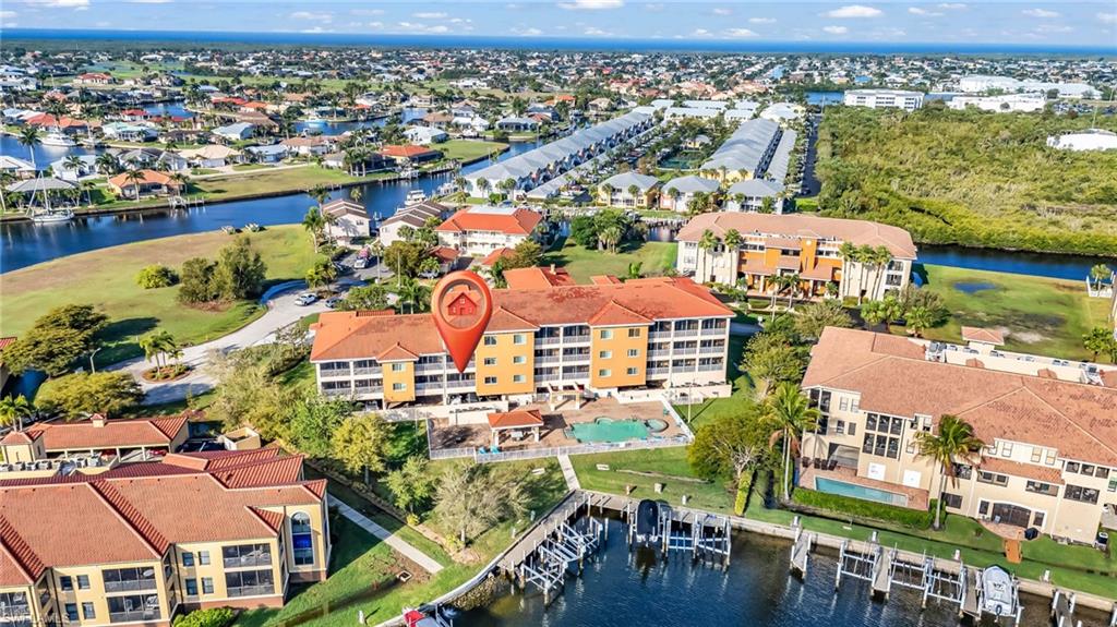 ELEVATED WATERFRONT LIVING IN LA ROMANA (Building has elevator!) Start your mornings with coffee on the lanai as the water glistens in the distance, and end your evenings unwinding under the glow of a Florida sunset—this is the kind of everyday life waiting for you at La Romana. Perfectly positioned in an elevator building, this beautifully maintained 2 bedroom + den condo (almost 1,400 sqft) offers the ideal blend of comfort, flexibility, and effortless coastal living. Whether you need a home office, cozy reading space, or a dining room for hosting, the den adapts to your lifestyle. Natural light fills the living space, drawing your eye out toward the peaceful water view and creating a calm, inviting atmosphere. Step onto your private lanai and you’ll quickly realize—this is where you’ll spend most of your time. The kitchen is finished with some of the highest-end granite available and all new appliances, giving you quality and style without taking away from the relaxed, easy feel of the home. Downstairs, the lifestyle continues. Spend your afternoons at the resort-style pool and hot tub, host friends at the waterfront pavilion with BBQ area, or gather around the fire pit on the deck as the sun goes down. This is a community designed for connection, relaxation, and enjoying where you live. You’ll also appreciate the everyday conveniences of two designated parking spaces and a large private storage room—perfect for bikes, beach gear, and everything that comes with an active Florida lifestyle. While this unit does not include a deeded dock, the community has a friendly, social boating culture where opportunities to lease or coordinate dock access are often available—keeping the waterfront lifestyle within reach. Located just minutes from downtown Punta Gorda, Fishermen’s Village, waterfront dining, and scenic parks, you’re never far from your next sunset, bike ride, or night out. This isn’t just a condo—it’s how you want to live; easy, elevated, and connected to the water