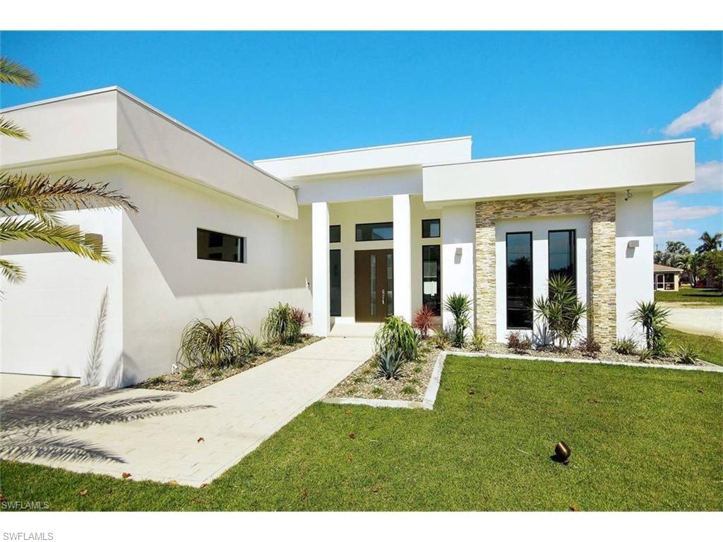 A BEAUTIFUL true European, linear design, contemporary home. Fully "Smart Home" capable. Massive lanai under roof, with private sitting area for 1 of 3 master en suites. Large outdoor living area with 2 waterfalls, mood lighting, oversize heated pool, sun deck, and more. Ceilings heights range from 18' to 12'. Natural lighting fills this home making it unnecessary to use very much electricity during the day. Home comes fully furnished, turnkey, with extra lot next door. Lot is already pavered, with landscaped yard behind. You can't build this home on your land for this price. Grab it while you can!