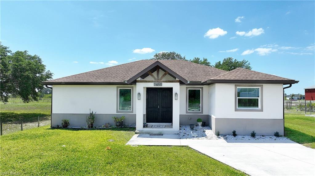 Wheeler subdivision!  The single family home has 3 bedrooms, 2 bathrooms, and a large detached 3 car garage or workshop with electric. The interior features granite counters, stainless steel appliances, and beautiful tile flooring throughout. Step outside to the screened lanai with a built-in grill and convenient half bath, perfect for entertaining guests or enjoying a relaxing evening at home. But the upgrades don't stop there - this property also includes a separate detached RV covered parking with an electric plug-in, and a storage shed for all your outdoor equipment. Whether you're a car enthusiast, DIYer, or just looking for extra space to store your toys.This home on 1.25 acres has it all. It has all the amenities you could ever want and bring your farm animals. Schedule a showing today and make this house yours forever.
