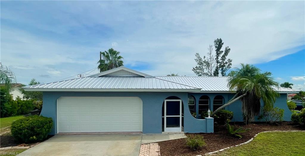 NEW 5V MEATL ROOF INSTALLED SEPTEMBER 2023. BEAUTIFULLY REMODELED 3BD/2BA w/2 CAR GARAGE home in the SOUTHEAST corridor of Cape Coral.  Whole house has solid surface tile floors. New granite in the kitchen with stainless appliances. Each bathroom has been upgraded, including HIGH PROFILE DUAL FLUSH toilets.  New tile in the showers.  Owner has installed a NEW GARAGE DOOR. EXTRA building located on the side of the home, this space could be used for storage or made into a workshop.  Easy access to the midpoint bridge, downtown Ft Myers River District and SWFL beaches!