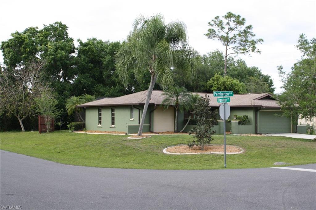 Updated double-master bed home.  House sits on a large, quiet corner lot and features large, mature oaks and foliage. Vaulted ceiling and open concept plan w/in the great room, along with large pocket slider make this home perfect for entertaining. The pool and pool deck were recently resurfaced and solar pool heating added. The central air system was replaced in 2015 to an updated energy efficient unit. Shingle roof and decking replaced in 2008 with secondary water barrier added; at this time storm shutters and garage door braces were added to maximize storm readiness and insurance discounts. The storm rated, insulated garage door is also a 2008 update as is the upgraded blown-in, cellulose insulation throughout the home. Laminate floors throughout with tile in wet areas. Features: New AC 2015 Refinished walk way to front door, pool resurface, tile, pool deck, pump and screen enclosure 2014 Laminate, tile floor, and tile back splash installed 2012 New exterior paint 2015 New shower fixtures in master shower including jets, 2016. The home includes storm shutters and security system on all windows and doors.