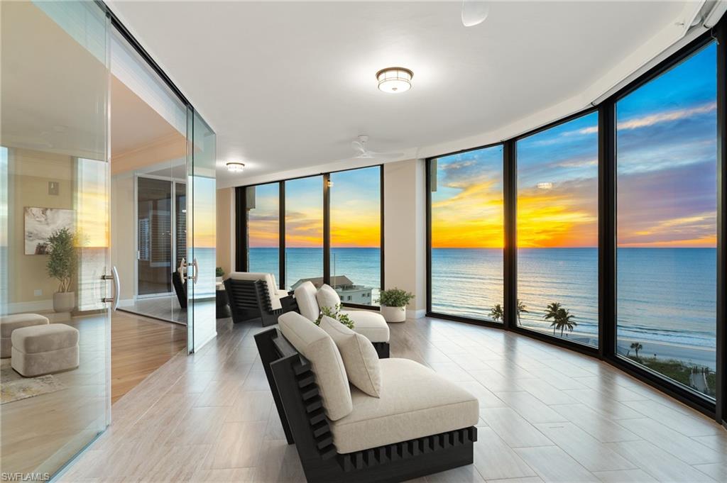 One or more photo(s) has been virtually staged, AI generated or rendered.  Ideally positioned on the 11th floor of the prestigious Seasons at Naples Cay, this three-bedroom plus den sky home showcases sweeping Gulf views and a spacious, residence-style layout. Step from your private elevator lobby into the expansive great room, where a dramatic wall of windows frames the coastline and 9+ ft ceilings combined with refined wood flooring create an inviting, airy ambiance ready for your personal design vision.  The gourmet kitchen exudes coastal sophistication with white quartz countertops, a light tile backsplash, custom cabinetry, natural gas range, and abundant storage, all seamlessly flowing into the dining area and beyond.  Designed for privacy, the split bedroom layout features a serene primary suite complete with dual walk-in closets, a generous spa-inspired bath, and unobstructed Gulf views. The separate guest wing includes two ensuite bedrooms and access to an eastern-facing terrace—perfect for sunrises.  Additional highlights include newly replaced windows, two parking spaces, and two extra storage units. Behind the secure gates of Naples Cay, The Seasons offers world-class amenities: a resort-style pool with outdoor cooking and bar, a state-of-the-art fitness center, 24-hour security, and more—delivering an exceptional coastal lifestyle. One or more photo(s) has been virtually staged, AI generated or rendered.
