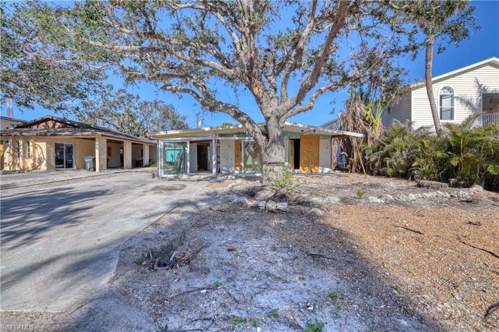Post-storm opportunity in the WEEKLY RENTAL district. Located mid-island, this 2 bed/2 bath pool home is a prime location with DIRECT BEACH ACCESS on Fort Myers Beach. The large pool area is a lovely sanctuary located at the rear of the property with a 10 x 20 pool. Both bathrooms remain intact and were beautifully upgraded prior to the storm. This property offers hurricane windows and has been deemed structurally sound and ready for new ownership! The seller will entertain owner financing.