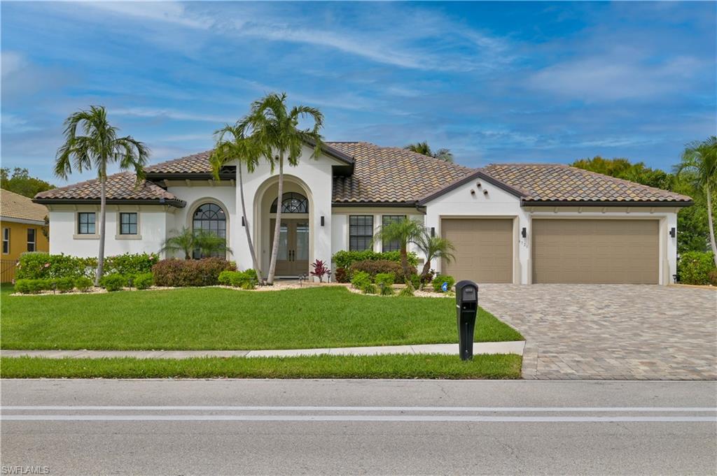 Incredible sunset views from your new gulf-access dream home with western exposure. True Florida living at its finest where the indoor living meets outdoor living through a massive wall of glass. Over 30 feet wide and 10 feet tall pocketing hurricane-rated sliding doors disappear to create a seamless experience overlooking the luxurious covered and screened lanai and pool finished with a beautiful paver deck. Luxurious pool bathroom is accessible from the lanai. The sweeping Chef’s Kitchen is surrounded by 42-inch custom cabinetry with soft-close doors and crown molding to finish them off. The massive kitchen island has counter-top outlets and cabinets all the way around for your storage needs. Custom built-in entertainment area in the palatial living room. 12-foot ceilings throughout the home complete with tray and coffered-ceilings in the living area and master bedroom. Plenty of space for all your toys, a large dock with 16,000 lbs and a 1,500 lbs boat lifts as well as a substantial 3-car garage with epoxy coated flooring.  Eight-foot tall interior and exterior doors. All windows and doors are hurricane-rated. This is the one you have been waiting for! Boat also for sale!