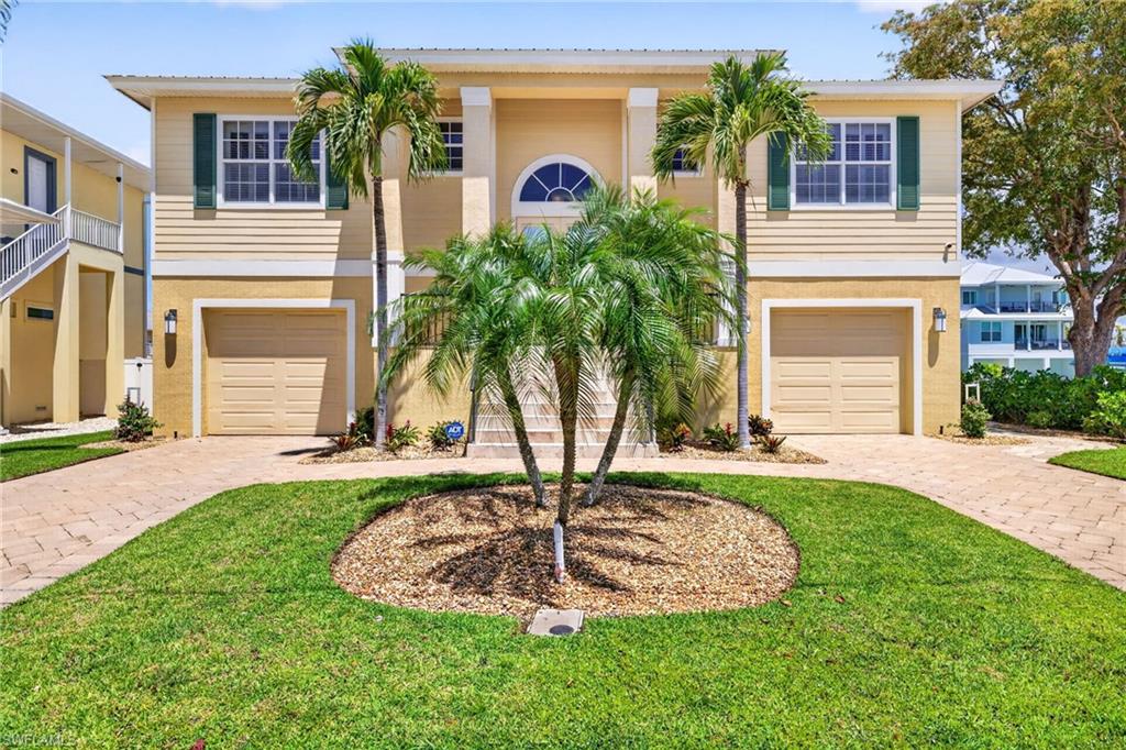 This stunning home just may be the one you’ve been looking for!  Ideally located with Beach Access only steps away.  Boat directly into the Bay, right from your dock that is equipped with electricity and water as well as a covered 15,000 lb. boat lift!  Adventures in the Gulf or Bay await!

Tastefully furnished, and offering 3 bedrooms and 3 bathrooms, this spacious home is ready for your enjoyment.  Spend time lounging around the pool enclosed with two stories of new no see-um screens. Experience the soothing sights and sounds around the waterfront.  Then enjoy the fun & convenience of the downstairs family room right off the pool with access to a nonconforming additional bathroom on the lower level.  
The upstairs outdoor seating and dining space can be accessed right off the living area via collapsing sliders or directly from the master bedroom via French doors. Gather around the firepit for morning coffee or evening entertainment.  

Additional features are lawn irrigation, 4 garage spaces, hurricane wall panels on the first floor, and even an elevator!  The boat & the ICON 6-passenger vehicle in the garage are negotiable.

Don’t miss out on the opportunity to make this home your personal paradise.  Pictures cannot capture the beauty and ambience this home has to offer!  Call today for a private tour!