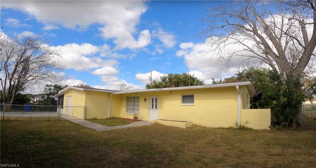 Solid block concrete  3 bedrooms 1 bath home that is in move-in condition fresh paint inside and out, tile throughout the house, NEW ROOF IN 2020. The spacious dining room opens up to the kitchen area. The kitchen features ample storage with newer kitchen cabinets and countertops 'one-year-old'. The bonus room you can use to entertain or make your craft room. Fenced backyard with a big area to put your new shed to store all your tools. The washer and dryer are included. This home is on city water and sewer. Don't miss out on this opportunity to live in the beautiful centrally located restaurants and shopping here in Lehigh Acres.