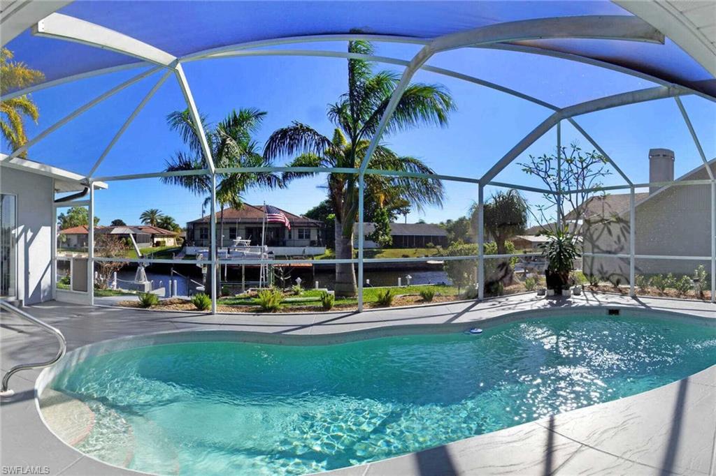 This is a VACATION RENTAL only. Owners will not consider annual rentals. Weekly rentals are welcome.
Villa Geraldine is a 3-bedroom, 2-bathroom property on a direct gulf access canal (7 minutes/.6 miles by boat) with an electric-heated pool. This home sleeps a maximum of 8 guests (including children) and is not pet friendly.

· · · · · PROPERTY PERKS · · · · ·
- Pack & Play
- Direct gulf access (7 minutes/.6 miles by boat)
- Boat lift
- Fire pit

· · · · · LOCATION · · · · ·
- Located in Southeast Cape Coral
- Close to Horton Park & Boat Ramp
- Close to Four Mile Cove Ecological Preserve
- Very close to Midpoint Bridge, which brings you to Fort Myers/Fort Myers Beach

· · · · · LIVING AREAS · · · · ·
- Flat-screen TV
- Comfortable seating
- Separate sitting area
- Electric fireplace in living room

· · · · · KITCHEN & DINING · · · · ·
- Fully equipped
- Dining area with seating for 6
- Additional space for 2 at breakfast bar in kitchen

· · · · · BEDROOMS · · · · ·
- Primary Bedroom: Two Queen beds, sliders to the pool & flat-screen TV
- 2 Guest Bedrooms: 1st has two Twin beds & sliders to the pool, 2nd has two Full beds

· · · · · BATHROOMS · · · · ·
- Primary Bathroom: Glass walk-in shower & dual-sink vanity
- Guest Bathroom: Shower/tub combo, dual-sink vanity & doubles as the pool bathroom

· · · · · OUTDOOR LIVING · · · · ·
- Electric heated pool
- Eastern pool exposure
- Dining area with seating for 4
- Sun loungers
- Grill
- TV on Lanai
- Fire pit at dock
- Boat dock & boat lift
- Rocking chairs on porch in front of the home

· · · · · THIS HOUSE IS GREAT FOR · · · · ·
Families or multiple couples/friends or boaters who want quick gulf access