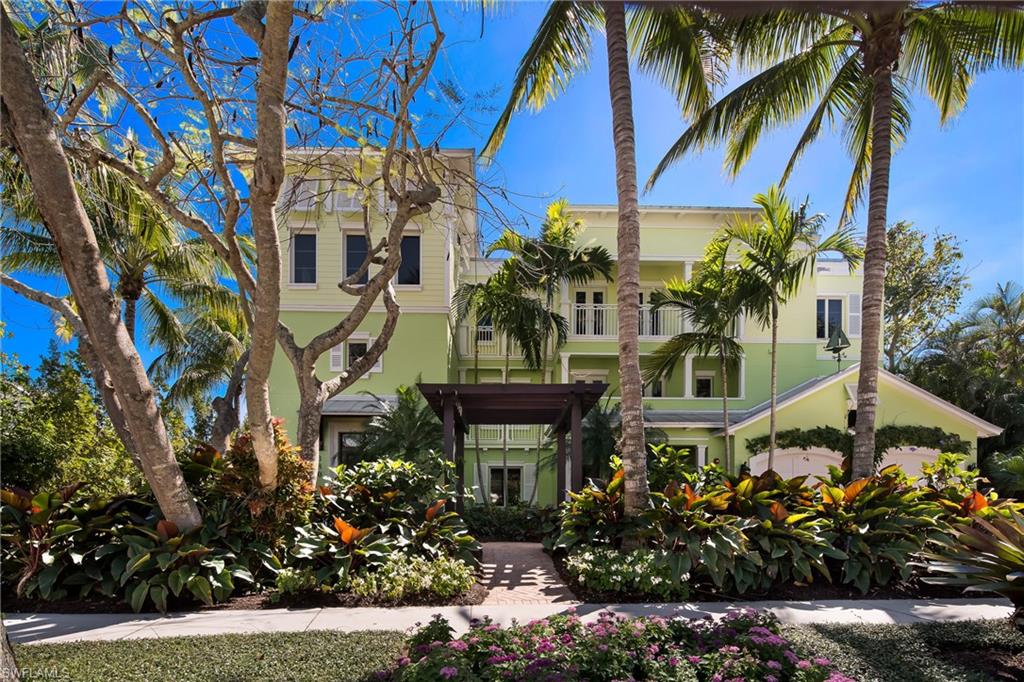 C.13352 - Paradise Found! Luxury living in the heart of Old Naples is found from the moment you enter with gorgeous hardwood floors, stunning architectural ceilings and exquisite surfaces in every room. The beautiful space is expertly customized to personify a prestigious Florida style and is a spectacular setting for intimate living or fabulous entertaining. The huge kitchen is made to be filled with family and friends and features custom cabinetry, oversized island and high-end appliances. Plus the proximity to the large family room and screened lanai is perfect for mingling! Instantly appealing is the owner’s wing with unmatched details; private balcony, huge shower, jetted tub, separate vanities and a walk-in that will satisfy a fashionista! Your guests will be delighted too with the sumptuous guest suites and private baths. While others are looking for parking, you can walk or bike to world class dining and shopping on 3rd St, and 5th Ave S. PLUS you can walk to the beach – it’s that close! ADA features are found in the home as well including elevator from entry and garage plus approved doorways. If you have been searching for your perfect place in paradise, this is it!