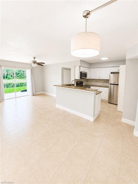 One or more photo(s) has been virtually staged, AI generated or rendered.  Welcome to IBIS CLUB! This beautifully updated first-floor residence offers 3 bedrooms and 2 bathrooms in one of Naples’ desirable gated communities. The open-concept floor plan features a  kitchen with granite countertops, white cabinetry, stainless steel appliances, and a breakfast bar overlooking the spacious living and dining areas. Tile flooring throughout and an in-unit washer and dryer provide both style and convenience. Enjoy peaceful views from the screened lanai and the comfort of a functional layout designed for everyday living. Residents have access to outstanding community amenities, including a clubhouse, swimming pool, fitness center, and playground, all within a secure gated community. Conveniently located near shopping, dining, schools, and Naples’ beautiful Gulf beaches. This is an excellent opportunity to enjoy the Southwest Florida lifestyle.