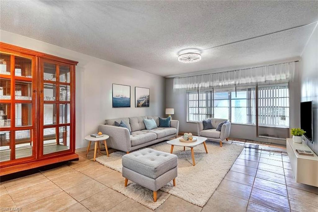 Welcome to UNIT 309, 1828 Pine Valley Dr., in the beloved Seven Lakes 55+ Community: A third floor, golf course view condo that offers PEACE OF MIND, POST-STORM RESILIENCE, AND MOVE-IN READY COMFORT. This unit survived TWO MAJOR HURRICANE WITHOUT DAMAGE: INCLUDING IRMA(2017) AND IAN (2022). No flooding, no roof loss, no repairs needed. Just a temporary power outage, as experienced throughout the region. This 2 bedroom, 1 bathroom fully furnished unit is ready to move right in!! Pictures shown are how the condo looks today: well kept, solid and undamaged. Just bring your personal belongs. 
The Condo has Updated Tile Flooring in Main Living Area, Kitchen and Bathroom. Laminate wood-like flooring in both bedrooms, No Carpet Here. Screened in Lanai with Direct view of the beautiful Golf Course. The unit is walking distance to all the amenities which makes this condo very convenient. No Hurricane Damage here, Concrete Block Construction, condo offers peace of mind, post-storm resilience and move in ready comfort. Extra Storage Closet by the Elevator. Seven Lakes is an active 55+ community with lots of events to get involved: Bundled Golf, (No Green Fees, No Trail Fees), 6 Clay Tennis Courts, 6 Heated Pools, Pickle Ball, Billiards, Wood Shop Fully Stocked, Carving Room, Hobby & Crafts Room. Exercise Room with brand new equipment, Lapidary, Awesome Library! Full Time Recreation Department Puts Out Calendar of Events in Monthly Newsletter. BBQ Grills, Courtyards, Bicycle Racks, Walking/Sidewalk Trail. Auditorium Hosting Lots of Fun Happenings Too. Private Restaurant & Bar On-Site with full restaurant and outside screened-in eating patio too. Has Weekly Events like Karaoke and Trivia, Theme Dinners & Happy Hours. Start Living the Seven Lakes Lifestyle! in.