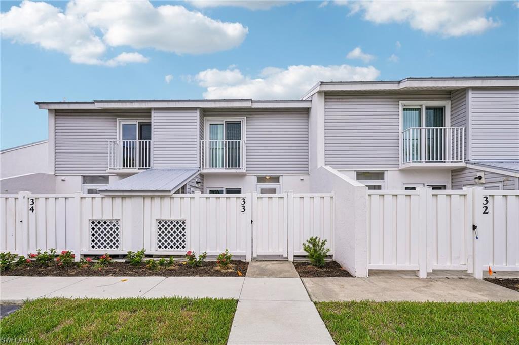 Experience waterfront living at its finest in the highly sought-after Boardwalk Caper community **Quarterly Fees Recently Reduced**. This fully remodeled residence includes its own *Deeded boat slip* and showcases modern coastal elegance with exceptional finishes throughout. The open-concept floor plan features large-format porcelain tile flooring, a designer kitchen with custom cabinetry, quartz countertops, cafe collection appliances, and an oversized island that seamlessly connects the living and dining areas. The spacious primary suite offers a relaxing retreat with contemporary finishes, while additional guest accommodations provide comfort and privacy for family and visitors. Every detail has been thoughtfully updated, including remodeled bathrooms, modern lighting, custom stair railings, updated flooring, and a beautifully designed laundry area, creating a truly move-in-ready home.Enjoy peaceful courtyard/pool views from the enclosed lanai, perfect for morning coffee or evening relaxation. The residents enjoy access to multiple heated pools, tennis and pickleball courts, clubhouse, marina, waterfront boardwalk, and an active social atmosphere.Ideally situated near Fort Myers Beach, shopping, dining, and entertainment, this exceptional waterfront property offers the perfect combination of luxury, convenience, boating access, and coastal living.