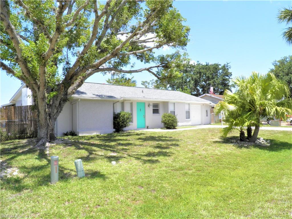 LOCATION, LOCATION!! Single family with a garage and on a lake and only minutes to the beach for under $250,000!!  This home is located within the quiet neighborhood of Sandy Hollow and it is NOT in a flood zone! Split bedrooms, and an extra large lanai are just two features that this home has to offer. Other features include: a new roof in late 2014, newer A/C and ductwork throughout the house, water heater, and garage door opener. This home is located less than 30 minutes from the Southwest Florida International Airport and only minutes to everything that the Estero, Bonita Springs, Naples areas have to offer! Beautiful white sand beaches, awesome shopping, and world class dinning are waiting for YOU!