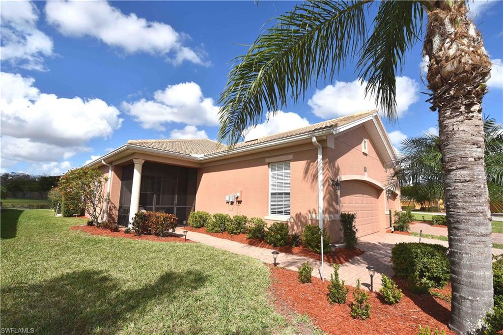 Bella Terra is one Estero's premier communities. It offers more amenities than most, but without the high fees of Golf Course communities. The impressive line up of amenities include: Gated Security, In-line Skating rink, Bocce, Pickleball, Tennis, Playground, Basketball,Joggin Path, Soccer, Baseball/Softball field, Fitness Center, Resort style Pool and Spa and Sand Volleyball. The attached villa is located on a lake with 2 bedrooms, 2 baths home with diagonally laid tile floors and carpet. The kitchen offers hardwood cabinets, solid surface countertops, pantry and Stainless Appliances. There are high ceilings, elegant decor and a beautiful view of the lake from the screened lanai. The attached 2 car garage, Tile roof and paver driveway and sidewalk rounds out the package.