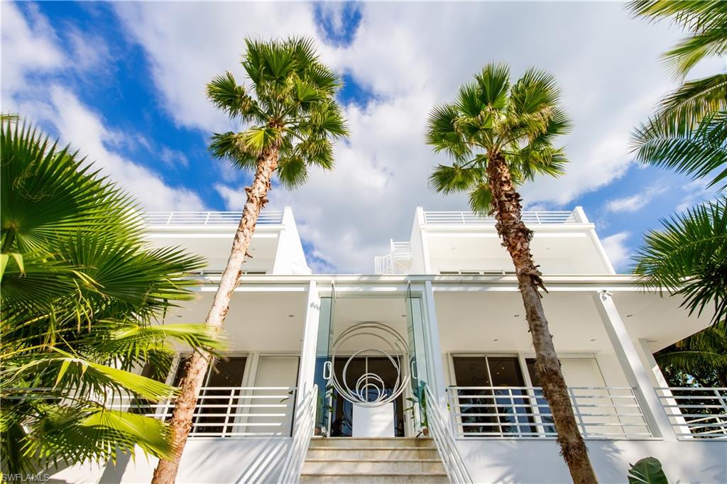 Find peace and serenity in this direct Gulf-front, one-of-a kind home, designed by Darryl Pottorf for the late Robert Rauschenberg. A true piece of Island history, never offered before. Surrounded by lush native landscaping for the ultimate in privacy, this unique floor plan offers breathtaking panoramic Gulf of Mexico views from every room. Dramatic Brazilian wood stair case entry. Spectacular great room with volume ceilings and impact glass sliders that open to a terrace overlooking the turquoise waters of the Gulf of Mexico. Polished white Corian floors throughout, private elevator, open gourmet kitchen, separate pantry and laundry room. Two master suites with private balconies and walk-in closets. Large sundeck separates the two en-suites where a spiral staircase leads to a roof top sun deck. Paver driveway and a 3-car + garage. All the bells and whistles in security and fire protection.