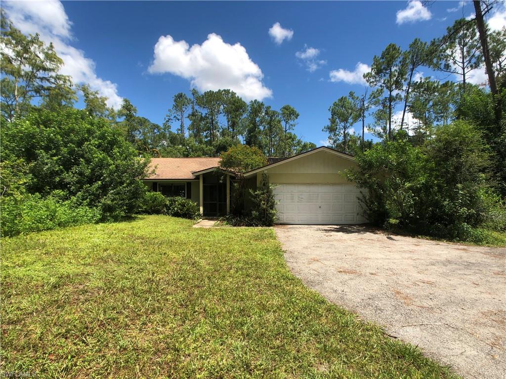 Over 1.5 acres in Logan Woods!! Main house has almost 2300 SF and is a 3 bedroom 2 bath home. Vaulted ceilings and open floor plan make it feel larger than it is. Pool area offers large covered seating area and a screened in pool. Property also has a garage area with small living space above on the back of the lot. Condition unknown as it is inaccessible at this time