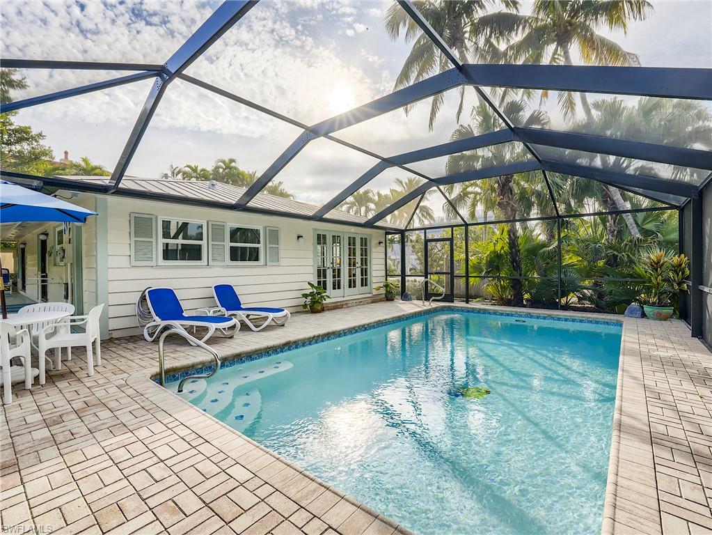 Over the years, one of the most popular weekly vacation rental homes on Captiva has had an exceptional rating by VRBO guests.  2026 advance rentals are already over $100,000.  This classic Captiva cottage-style home is totally updated with new LVP flooring, two new baths, new quartz kitchen with new S/S appliances, and a separate laundry room.  The home is very well furnished for guest comfort with 3 TVs and a living room audio system with Bose speakers, and also speakers on the pool deck. The French doors from the living room and full-length screened lanai lead to the 2024 resurfaced 26 x 13 electric heated pool. All windows are impact rated installed by StormSmart in 2021.  The pool cage was new in 2023, pool heater in 2025, new A/C in 2021, and the W/H in 2023.  A spacious and separate outdoor storage shed is on the rear corner of the property for storage of beach equipment. Beach access is a 3-5 minute walk to the path by the Library and Chapel by the Sea.  The Green Flash Restaurant is a 1-minute walk, and the village center is a 5-minute walk.  Due to busy weekly guest occupancy, showings will be accepted by appointment only on a Saturday with guest turnover, and between 12 and 2 pm.  Future guest reservations after closing must be honored.  Any advance or final rental payments shall be credited to the buyer at closing. Closing date request is not before August 1, 2026.