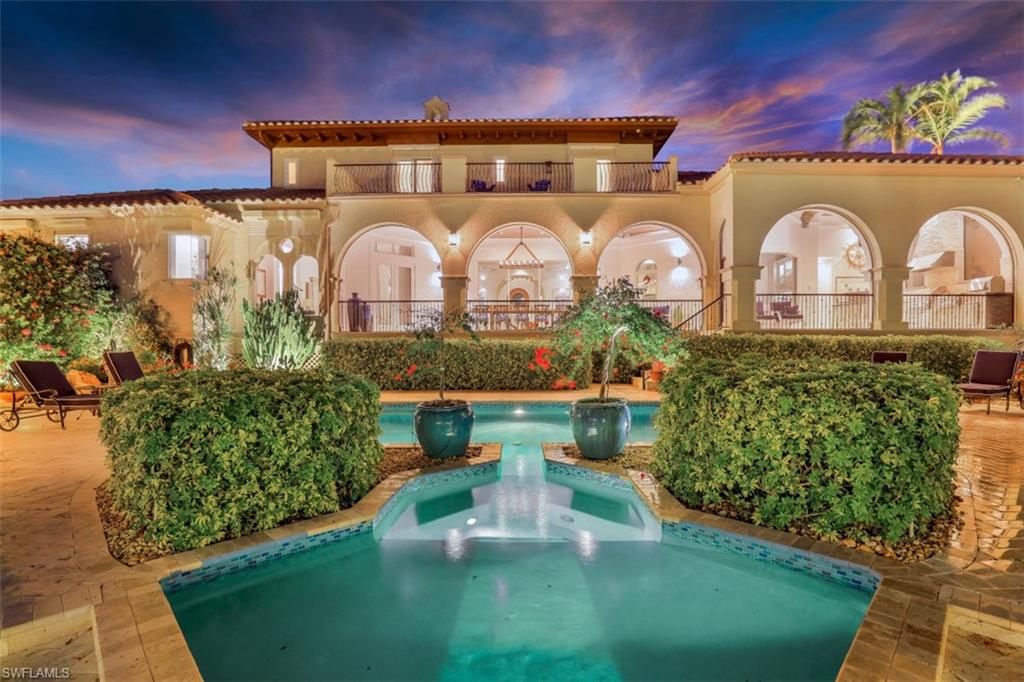 SPECTACULAR RIVERFRONT VILLA designed by renowned architect and reimagined by the int’l designer, owner. This Tuscan style home w/ its timeless features is a rare find. Lush landscaping is offset by the beauty of the home. Large thick wood + glass door welcomes you into the vestibule and through to the opulent grand room and its breathtaking river views. The light and open grand room was designed for comfort and entertaining. The gourmet kitchen is the envy of any chef, white cabinets are showcased w/ Blue Bahia Granite + stainless. There is a breakfast nook and a formal dining room w/ a custom Italian crafted dining set and wine closet. The light and airy owners retreat is heaven. Enormous custom closet. Ensuite w/ double vanities and showers indoors + out. Entertainment room and 2 bedrooms w/ ensuites grace the 2nd floor. Rentable Guest House off the kitchen shares a balcony w/ the artist’s studio. Outdoor kitchen + bar are adjacent to a massive lanai which overlooks the backyard wonderland w/ seating areas under the shade of sculpted oak trees and gazebo. The heated pool is naturally private.  206’ seawall + captain’s walk. 25k lb covered boat lift plus lift platform for toys.