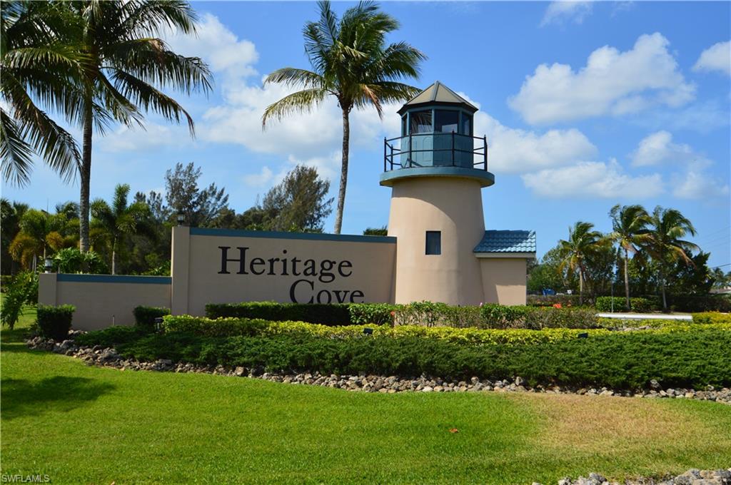 Here it is:  TWO Bedrooms PLUS a Den!  RARE find!  Ground Floor END Condo Unit is available in Heritage Cove 55+ Community and it is TURNKEY!   This condo has been Exquisitely and Tastefully Decorated and waiting for You and your luggage.  This END Unit includes Extra Windows for Perfect Natural Sunlight and Views of the Lake.  Relax on the Lanai and Listen/Watch the Breathtaking Lake Fountain.  The Fountain can be seen from the Lovely Master Bedroom complete with TWO walk-in Closets and Private Master Bath.  The Guest Bedroom is Spacious and the Guest Bathroom is Impeccably Decorated.  There is a Laundry Room with Washer/Dryer in the Residence.  The A/C and Water Heater are newer.  There are Hurricane Shutters to protect your home from storms.  The Quality Furnishings from Coaches, TVs, Bedroom Sets all the way to the silverware are INCLUDED in this Sale!  Heritage Cove 55+ Community is Fabulous!  You will love the Community Center, Huge Pool/Spa, Many Tennis Courts, Social Events and Exercise Room.  The Community has LOW Fees, a Gated Entrance and it is close to EVERYTHING!  You name it Airport, Shopping, Restaurants, and Beaches!  Buy the CONDO!