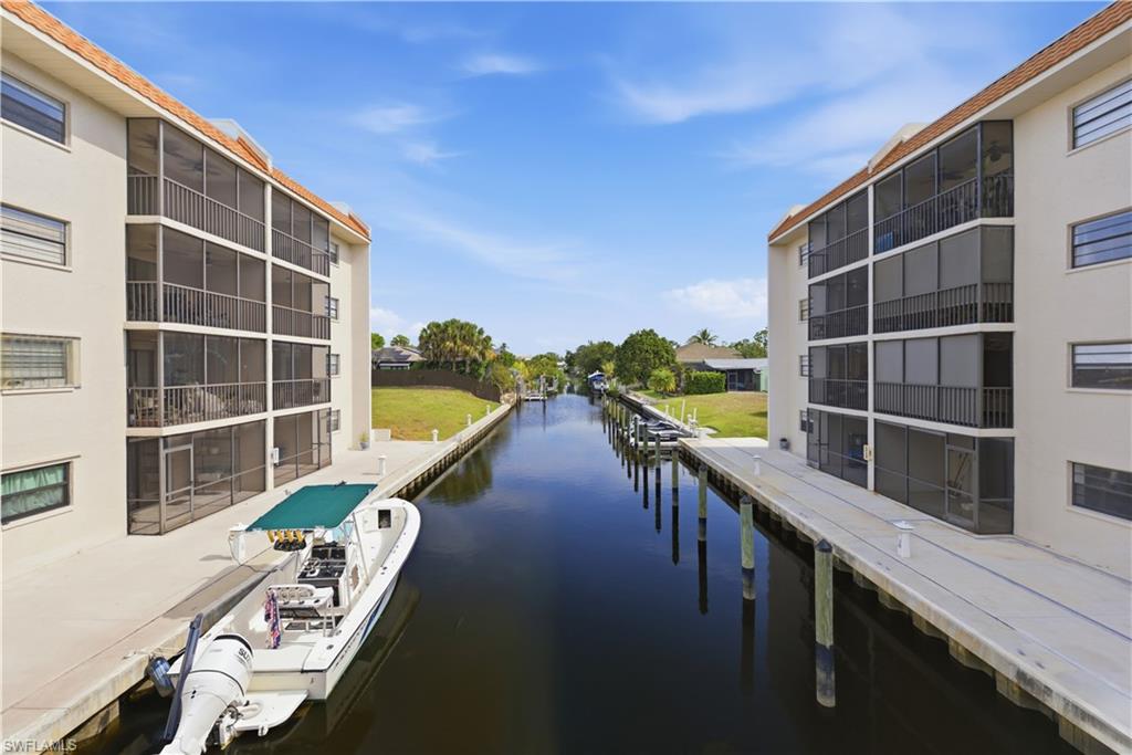 An exceptional opportunity to own a beautifully maintained two-story, 3-bedroom, 3-bath condominium in the heart of Bonita Springs with optional boat slip access and direct Gulf access. Nestled within the highly desirable waterfront community of Spanish Harbor, this hidden gem offers the perfect blend of coastal charm, boating lifestyle, and investment potential with the added benefit of a flexible 30-day rental policy. Lovingly maintained by a long-time owner, this residence features an inviting multi-level layout with all tile flooring, spacious living areas, and two screened lanais showcasing peaceful western-facing views, perfect for enjoying breathtaking sunsets, canal scenery, and local wildlife, including frequent manatee and osprey sightings. The main living level offers a bright open-concept design ideal for entertaining, while the versatile lower level provides endless possibilities for a guest suite, recreation room, home office, or private retreat. The third bedroom on the lower level is unfurnished, allowing you to personalize the space to fit your style and needs, and includes a generous closet with an adjacent full bath. Residents of Spanish Harbor enjoy a true waterfront lifestyle with direct Gulf access, first-come first-served boat slips at no additional cost, kayaking opportunities, a saltwater community pool, picnic and grilling areas, tiki huts with thatched roofs, outdoor shower and restrooms, and expansive green space along the canal. Low-maintenance ownership is enhanced with water service included in the condo fees. Located on a quiet dead-end street, this low-density community offers tranquility while remaining within walking distance to downtown Bonita Springs, dining, entertainment, parks, and local attractions. Whether you are seeking a full-time residence, seasonal getaway, or income-producing investment property, this waterfront retreat delivers exceptional value, lifestyle, and location.