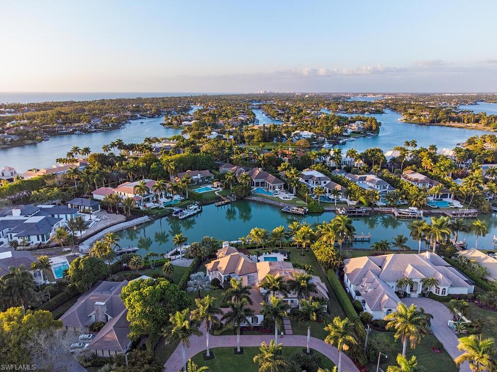 Custom home on nearly 1 acre in prestigious Port Royal! This estate has 135 feet of water frontage, accommodates a 95-foot dock. Recently updated and refreshed, the 5 bedroom 4 1/2-bathroom residence is thoughtfully designed and well laid out providing effortless flow from the interior living area to the expansive outdoor living space complete with outdoor kitchen, living area, and fire pit. The chef's kitchen features top-of-the-line appliances oversized island and gas cooktop. Residence has Port 
Royal club eligibility and it's just a short distance to 3rd Street South's and 5th Avenue South's fine dining, world class shopping, entertainment, and Naples' world-famous white sand beaches.