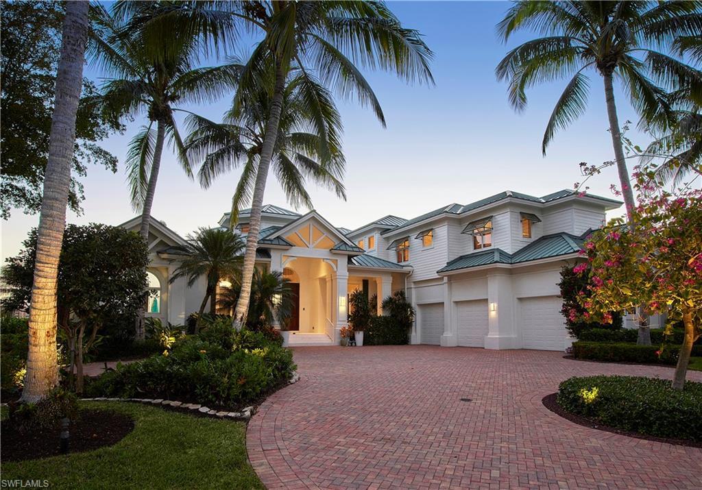 Commanding southwest bay views are panoramic from this spectacular Venetian Bay estate. 
The attractive front elevation has a coastal flair with the metal roof, shell stone entryway, planked detail and charming front porch.  The recently refreshed great room area provides a light and bright feel with modern stone fireplace, white coffered ceilings with painted cypress and a light wood floor.  The well-equipped kitchen offers a prep island and breakfast bar overlooking the great room and sparkling water beyond. The second floor is for the view and offers a large screened balcony and a split bedroom plan with two spacious bedrooms overlooking the water and two extra private rooms. Backyard design inspiration are ready and could help make your dream home a reality in no time!