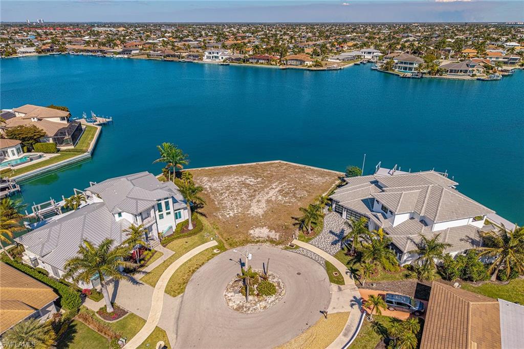 Incredible location, expansive views and building opportunity from this tip-lot location with 169 feet of indirect access bay frontage on Landmark Waterway on Marco Island. Convenient location within short distance to some of Marco Island's popular restaurants, shopping, entertainment and beach. Build your dream home on this beautiful property with panoramic bay views, .31-acre and enjoy the lively view of marine and area wildlife, great fishing and quick access out to the Gulf and 10,000 Islands for endless sightseeing and adventure.