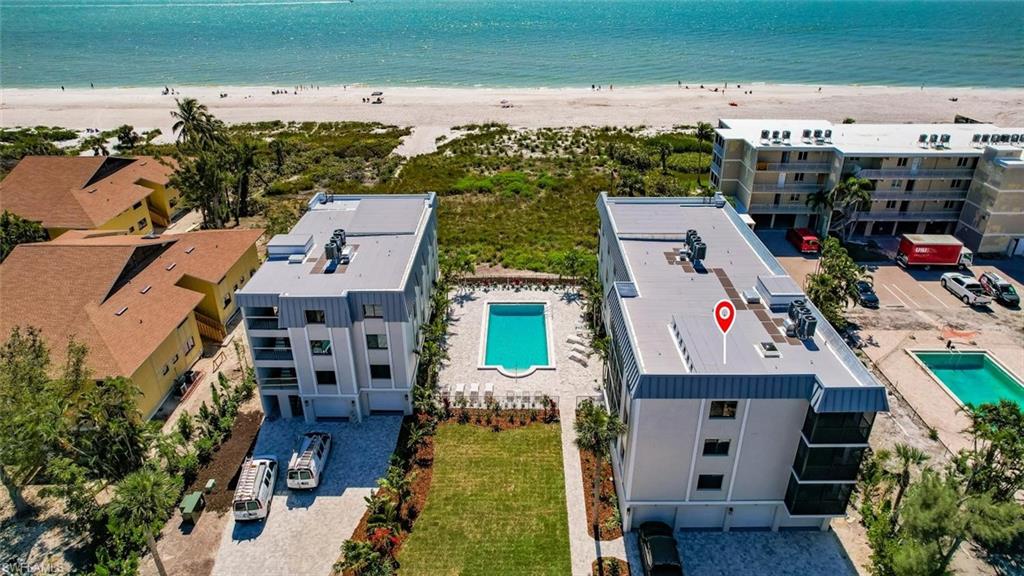 Welcome to Shorewood, one of the most luxurious properties on Sanibel. Only 13 units, completely remodeled with a new roof, paint, A/C, hurricane proof windows and sliding doors, a redesigned pool with a new paver deck, brand new paver driveway and parking, lush landscape, pavers and tile under the building, new elevators.... a completely brand new property! This spectacular condo is 3 stories high with 5 bedrooms, 4 baths, 2 kitchens, (on the first and third level) and each level has a very spacious screened balcony with a Gulf view. The condo also features 1 garage and a large enclosed storage unit under the building. Each floor is accessible by elevator. Completely furnished with brand new furniture, turnkey, 1 of very few condos on Sanibel that is ready to move in! 3400 square feet looking directly at the beach, great for a large family or a fantastic investment opportunity. The condo is in a vacation rental program producing great revenue. The buildings have been inspected per the current requirements and the reserve funds meet the new laws. The entire property is looking like a brand new resort, the very best that Sanibel has to offer!