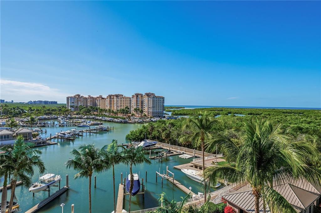 AQUA at Pelican Isle is Waterfront Luxury Redefined.  Where modern elegance meets world-class living.  This 3,590 sf furnished home has 4 bedrooms and a den and four baths. Two of the bedrooms are considered both Primary Suites.  Stepping from your private elevator, you are immediately drawn to the breathtaking views of the Gulf, Wiggins Pass, and AQUA’S private marina which can accommodate 55’ boats.  Both wood and marble flooring throughout.  The designer kitchen includes updated quartz countertops and backsplash, Snaidero Italian Cabinetry, Wolf Five Burner Cooktop, Oven and Microwave, Subzero Refrigerator, a Full Length Wine Refrigerator with tons of counter space including a center island.  The kitchen opens up to an expansive living/dining area with built-ins that open up to a spacious lanai where you can dine or simply relax and enjoy beautiful sunsets.  The Den/Office has stunning views of the new Kinsale Golf course where you can relax/work or convert to a 5th bedroom.  There are two spacious en-suite primary bedrooms both with spacious spa like bathrooms as well as two additional spacious quests suites.  All four bedrooms provide privacy for family and friends. Aqua is amenity rich which includes a private marina, direct access to the Gulf, low density living, rooftop terrace, fitness center, spa, movie theater, social rooms (2), virtual golf simulator, dog parks and a stunning waterfront pool, 24/7 Security & Concierge services to provide comfort, convenience and peace of mind.  Prime North Naples location, with minutes to Mercato, Vanderbilt Beach, Waterside Shops as well as Top Dining Destinations.  Memberships to the Pelican Isle Yacht Club (next door) are available.  Memberships include, Restaurants, Pool, Bocce, Tennis, and shurtle to the Beach.  Aqua is more than a building, its a lifestyle for those who demand the very best!