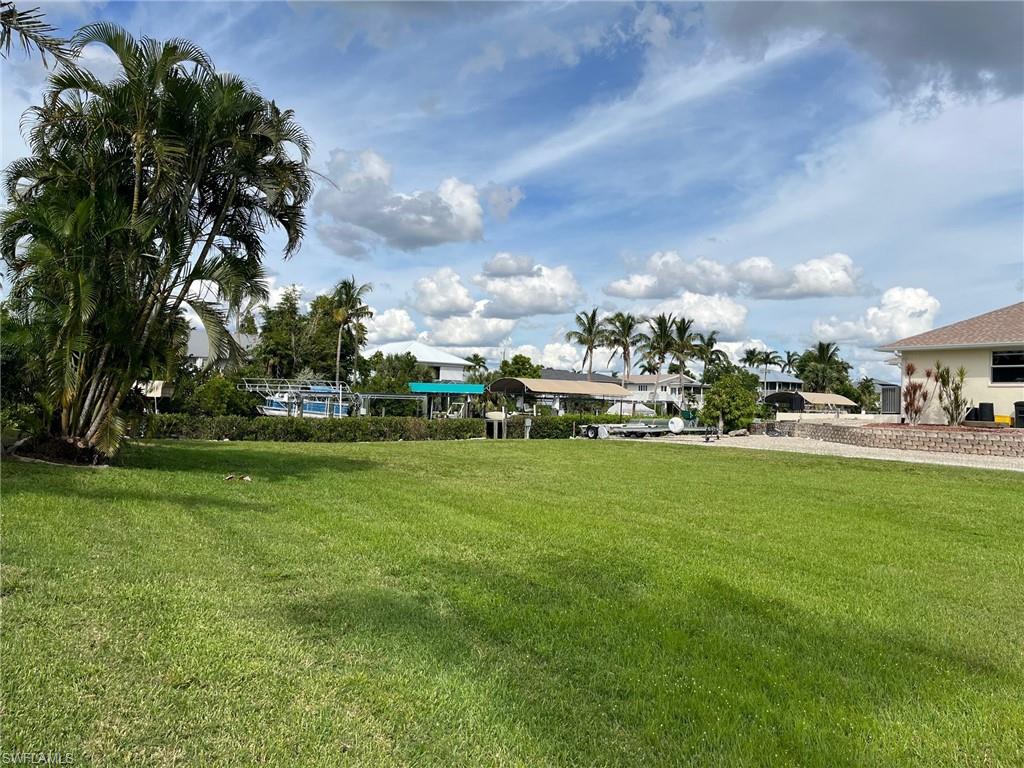 Waterfront Opportunity in Serenity Cove – Direct Gulf Access with Dock & Lift!

Build your island dream home on this rare .33-acre cleared canal-front lot located in one of Bokeelia’s most desirable neighborhoods, Serenity Cove. Surrounded by beautiful homes and offering direct Gulf access with no bridges, this property is truly a boater’s paradise—just minutes to world-class fishing, pristine beaches, and open water.

Already equipped for waterfront living, the property features a newly updated boat lift (2024), composite dock, and electric at the dock, allowing you to start enjoying the boating lifestyle immediately while you plan your custom home. From your backyard, enjoy easy access to Cayo Costa, Sanibel, Cabbage Key, and a short boat ride to Jug Creek Marina—perfect for waterfront dining, island hopping, and sunset cruises.

Professionally maintained mangroves enhance privacy while framing peaceful water views.

With no HOA restrictions, you’ll have the freedom to build at your own pace and create the coastal retreat you’ve been dreaming of. Seller may consider seller financing, adding flexibility to this exceptional opportunity.

Don’t miss your chance to own a ready-to-go waterfront lot in Serenity Cove—where island breezes, sunset cruises, and endless boating adventures await.