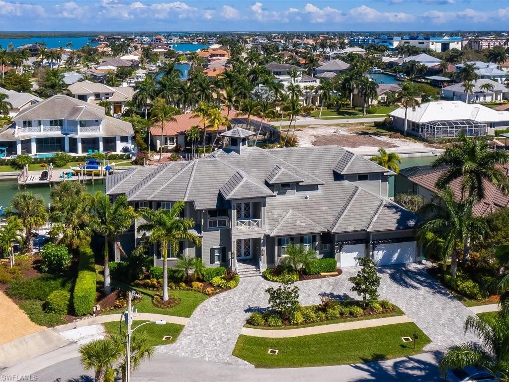 SPECTACULAR NEW “FLORIDA COASTAL DESIGN” DIRECT-ACCESS, LUXURY BAY VIEW (2015) HOME W/PRIVATE ELEVATOR! STUNNING 7BDR, 8BTH, 3 CAR GARAGE, MEDIA/GAME ROOM, LOFT, POOL/SPA. GREAT HOME FOR LARGE FAMILY/CORPORATE RETREAT. SOARING 16’ DOUBLE TRAYED & WOOD INLAY ACCENTED CEILINGS. MARBLE, WOOD, CARPETED FLOORING THROUGHOUT, 2 MASTER SUITES, DOWNSTAIRS MASTER SUITE HAS CROWN & COFFERED 12’ CEILINGS. HIS/HERS LARGE WALK-IN CLOSETS, DUAL SINKS, SOAKING TUB & TILE SHOWER. “GOURMET’S” KITCHEN CUSTOM WOOD CABINETRY, VIKING STAINLESS STEEL COMMERCIAL GRADE APPLIANCES INCL A 8 BURNER GAS STOVE. BIG GRANITE CENTER ISLAND, WALIK-IN PANTRY, & EAT-AT-BAR. PERFECT FOR FAMILY GATHERINGS. 1ST FLOOR HAS MASTER BEDROOM, GUEST SUITE, & DEN/OFFICE. THERE ARE 5 MORE “GUEST SUITES” UPSTAIRS ALL W/IN-SUITE BATHROOMS, “INCREDIBLY HUGE” MULTI-MEDIA/POKER ROOM, WITH 8' BAR AND MULTI-MOUNTED TV'S W/WIDE SCREENS TO WATCH ALL THE GAMES. ALL WINDOWS & SLIDERS ARE LEVEL 5 IMPACT & STORM RESISTANT. LARGE POOL AND POOL PAVER DECK LANAI WITH A SOUTH BEACH STYLE OUTDOOR DESIGN. GORGEOUS CUSTOM SUMMER KITCHEN WITH GAS GRILL, REFRIGERATION, WINE STORAGE & BAR FOR POOLSIDE ENTERTAINMENT. COMES WITH A 1 YEAR HOME WARRANTY.