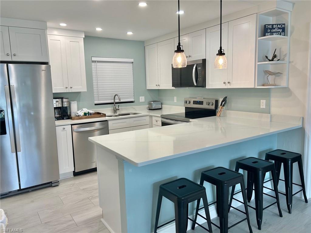 Best value at Blind Pass! This fully furnished 2 bedroom, 2 bathroom condo has been recently remodeled and ready for your enjoyment! Bright kitchen with stainless steel appliances and white cabinets opens to your oversized living and dining spaces. Each large bedroom has its own bath and spacious walk in closet. Coastal decor and plantation shutters. Community pool, clubhouse, tennis court, pickle ball court, grilling area, and boardwalk to deeded beach access. Units can be rented weekly or use for your own enjoyment.