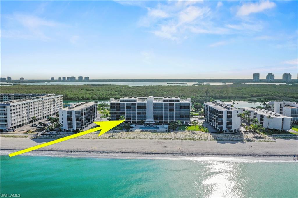 Wake up to the sound of crashing waves and step into coastal living at its finest. This stunning direct beachfront retreat on Little Hickory Island offers a thoughtfully designed open-concept layout that maximizes every inch of living space. As you step inside this inviting 1-bedroom, 1-bathroom condo, you are greeted by spectacular coastal views framed by newer impact-resistant sliding glass doors. These premium doors provide excellent energy efficiency and storm safety, while newer electronic roll-down storm shutters allow you to secure your entire home at the touch of a button. The kitchen boasts sleek stainless steel appliances, elegant granite countertops, and crisp white cabinetry for a perfect blend of style and functionality. Durable tile flows beautifully through the living areas, while plush carpet creates a cozy sanctuary in the bedroom. The bathroom features a convenient bathtub and shower combination for ultimate comfort.The desirable Seascape community offers unbeatable resort-style amenities and endless activities to keep you active. Relax by the sparkling Gulf-side swimming pool and watch the waves roll in, or enjoy the pickleball, tennis, shuffleboard, and basketball courts. The property also features a covered BBQ area and offers boat docks available for purchase. Direct beach access for your daily sunset walks, you are just minutes away from local waterfront dining, shopping, and entertainment. Whether you are looking for a personal coastal sanctuary, a vacation getaway, or an income-producing rental property, this beachfront gem offers a rare opportunity for unparalleled island living.