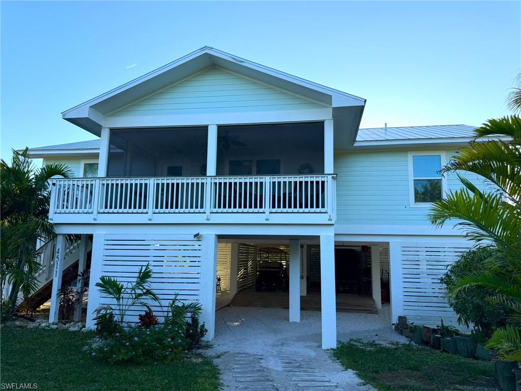 A Must See! North Captiva Island FABULOUS Young Island Pool Home! Beautiful Coastal Turnkey Furnished Three Bedroom, Two Full Baths, Single Family Stilt, 2021 Year Built on a Private AND Oversized Half Acre - Corner Lot! FANTASTIC On Island Location! Close to the Beach and Seconds to The Island Club at North Captiva its’ Marina, Mangos Restaurant and Bar, Mangos Convenience Store, and the Boats and Fun Island Store. Bright, Open, Great Room Floor Plan. Split Bedroom Floor Plan. Lovely Kitchen with Large Center Island with Breakfast Bar. Great Sized Bedrooms and Upgraded Full Baths. Wonderful Front Screened Balcony and Large Back Open Balcony Overlooking the Inground Pool and Grounds. Other Features and Upgrades Include: Ideal Newer Construction, Impact Resistant Windows and Doors, Hardie Board Siding, New Whirlpool Appliances, Granite Countertops, Dual Sinks in Both Baths, Upgraded Tile Bath Walls, Convenient Laundry Room with Washer and Dryer, Luxury Tile Plank Flooring Throughout, Vaulted Ceilings, Metal Roof, Two Covered Carport Area(s), Large, Heated, Salt Water Pool, Outdoor Summer Kitchen, Entry Gate PLUS a Gorgeous, Fenced Yard - A Lush Tropical Oasis with Mature Assorted Palms and including Five Coconut Palms. Turnkey Furnished and Ready for Rentals Should you Wish for Rental Income Too! Special Note: A Boat Slip with Covered Boat Lift is also Offered for Sale in Addition to this Home Sale. It Accommodates up to 26’Boat and 10Klbs. Please Inquire with Agents. Paradise Awaits! Now is the Time to Make “Hidden Garden” your Island Dream Home and/or Investment Opportunity! Schedule Your Showing Today! NEWEST HOME AT THIS PRICE POINT BY FAR!