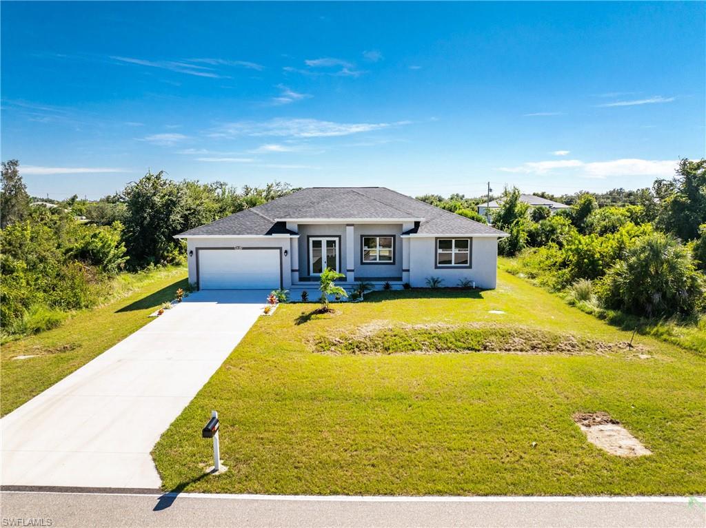This beautiful 4-bedroom, 3-bathroom, 2,100 sq ft single-family home in Port Charlotte, FL features a modern kitchen with granite countertops and stainless steel appliances, and a master suite with walk-in closet and en-suite bathroom. Additional bedrooms provide space for family, guests, or a home office. Tile flooring runs throughout the home. Also boasts a lovely 2-car attached garage.  Located in South Gulf Cove, close to shopping, schools, and waterways, perfect for families or retirees seeking Florida comfort and lifestyle. Room for a pool.